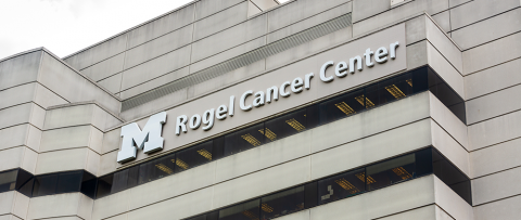 The Rogel Cancer Center building with its name displayed near the roof line.